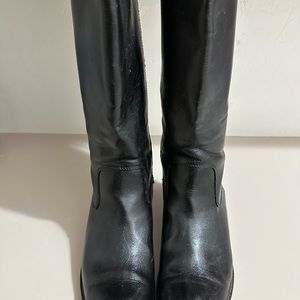 A pair of barely worn tall shaft boots.